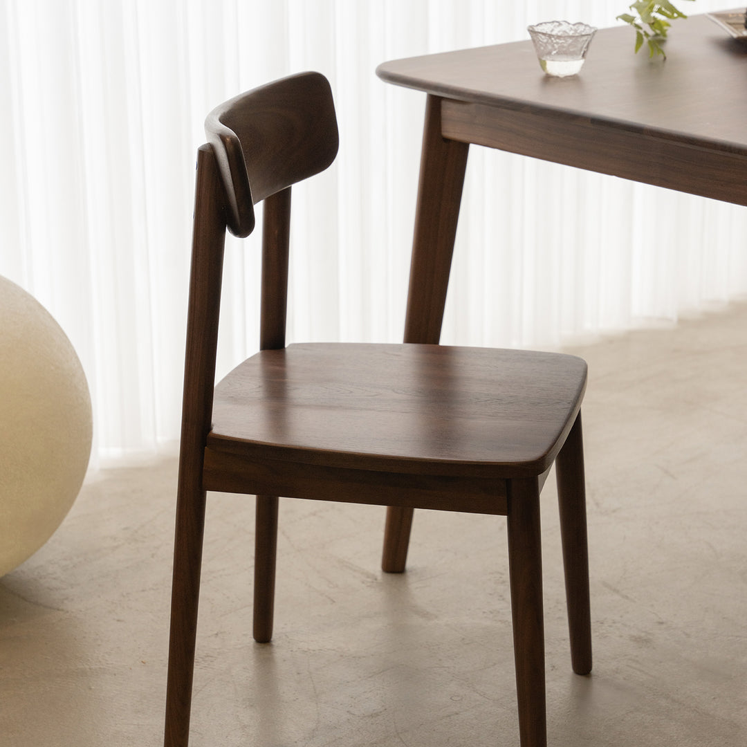 Vintage walnut wood dining chair green in real life style.