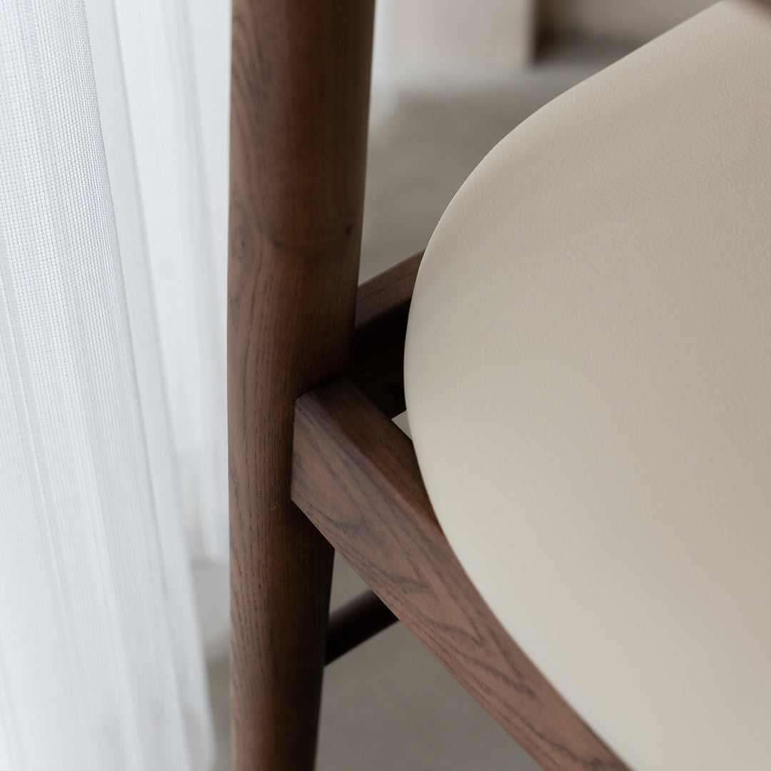 Vintage walnut wood dining chair purea in real life style.