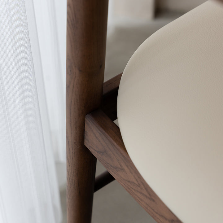 Vintage walnut wood dining chair purea in real life style.