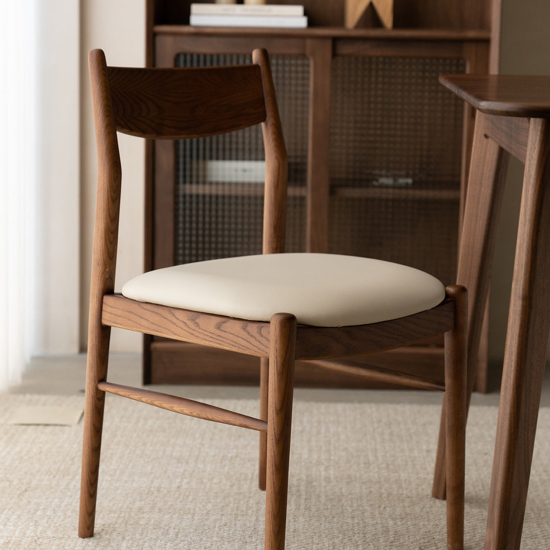 Vintage walnut wood dining chair purea with context.