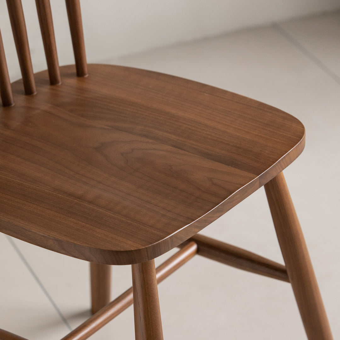 Vintage walnut wood dining chair windsor in still life.