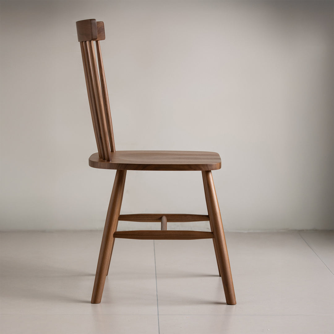 Vintage walnut wood dining chair windsor in panoramic view.