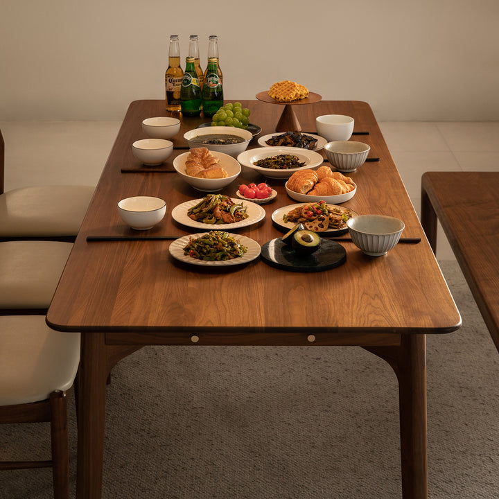 Vintage walnut wood dining table chrono in panoramic view.