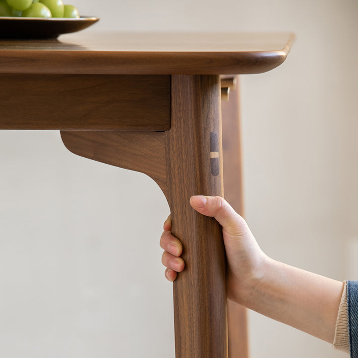 Vintage walnut wood dining table chrono in still life.