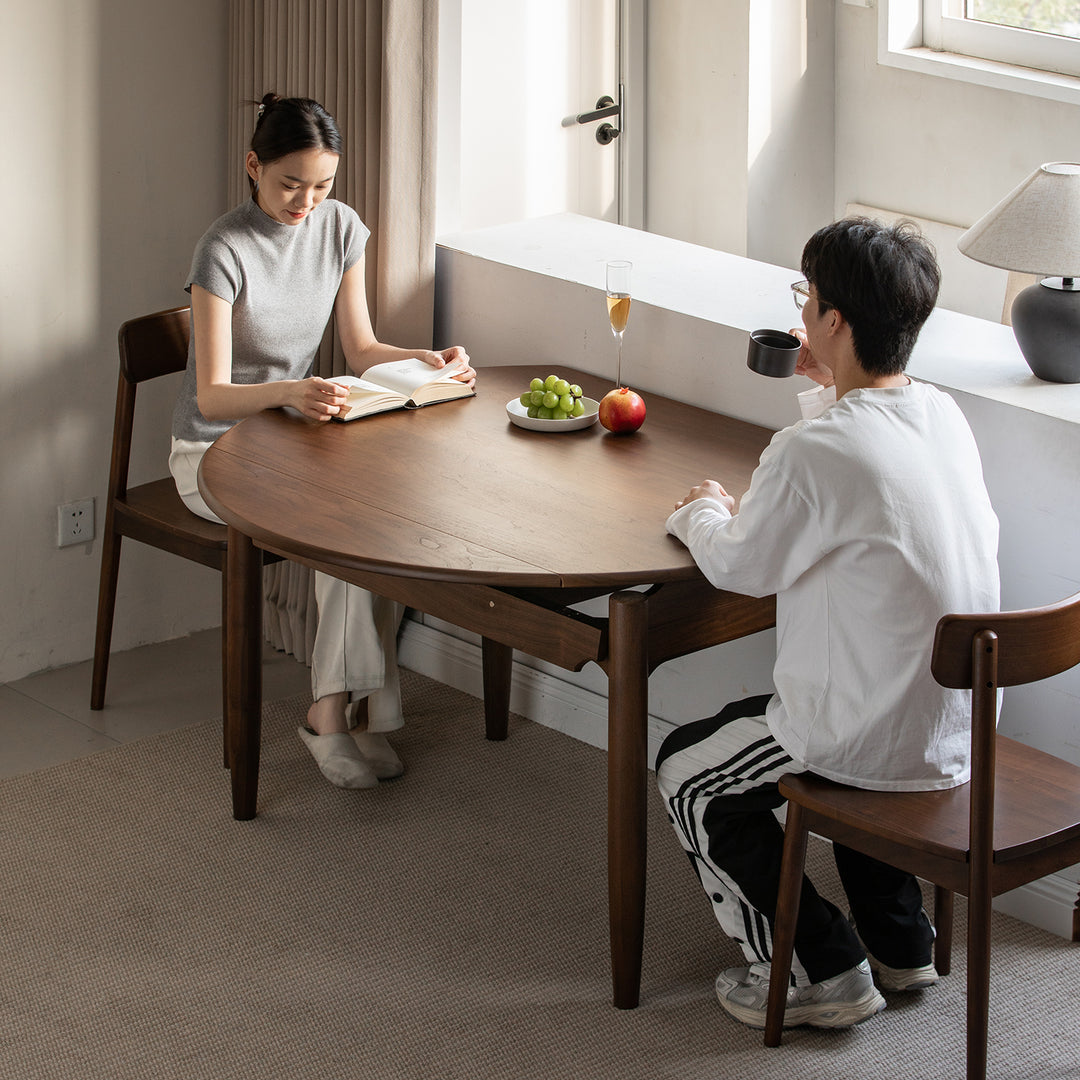 Vintage walnut wood extendable dining table minima in still life.