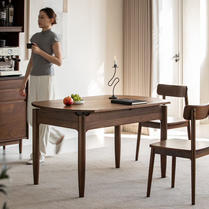 Vintage walnut wood extendable dining table minima in close up details.
