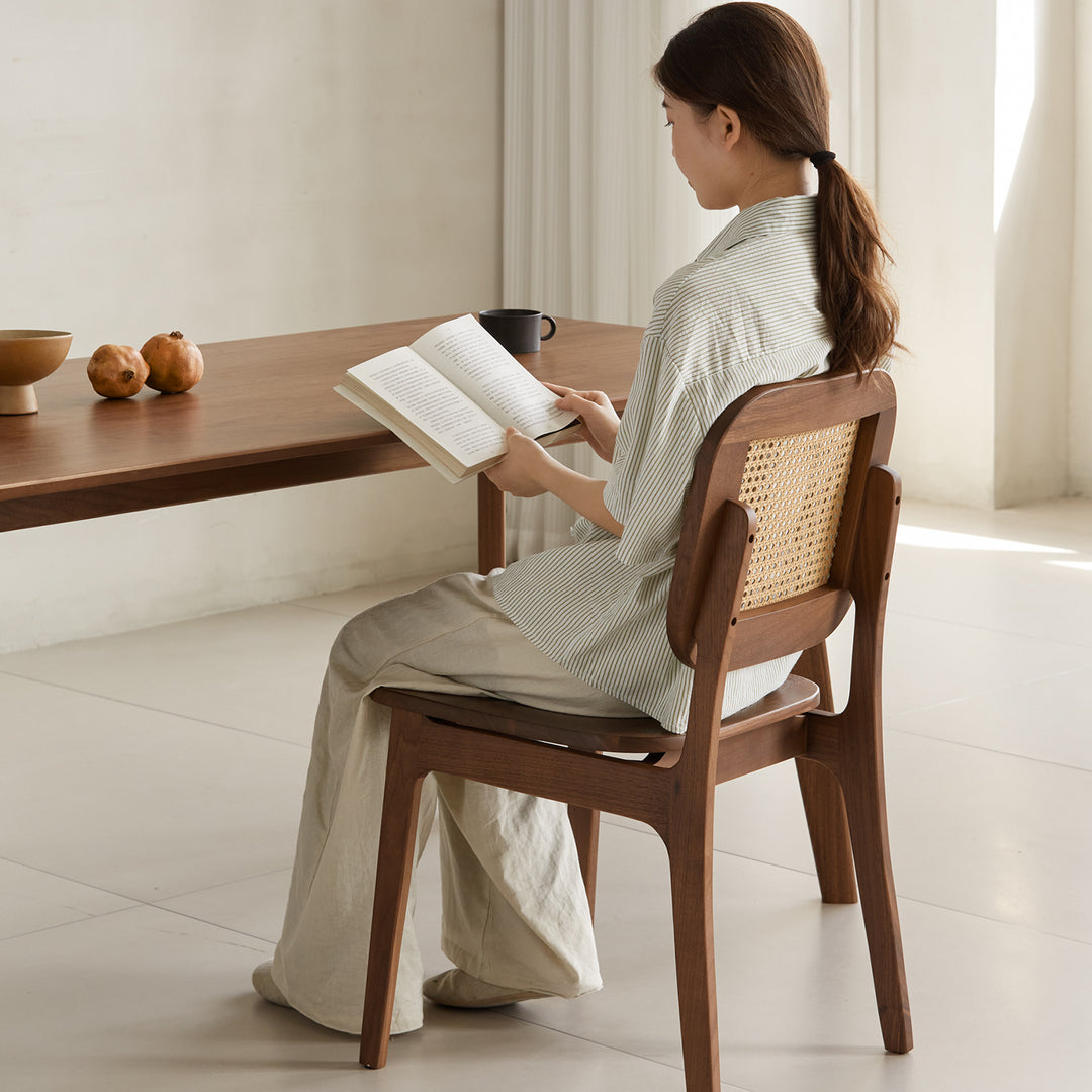 Vintage walnut wood rattan dining chair nook primary product view.