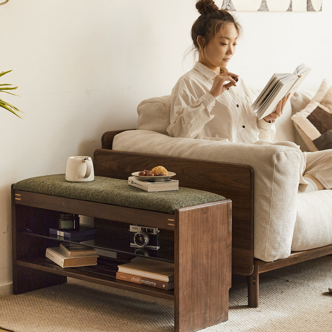 Vintage walnut wood shoe changing bench dawn in close up details.