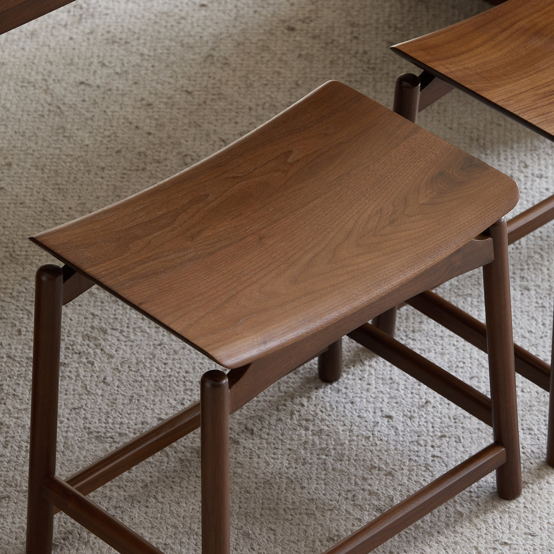 Vintage walnut wood stool arcus material variants.