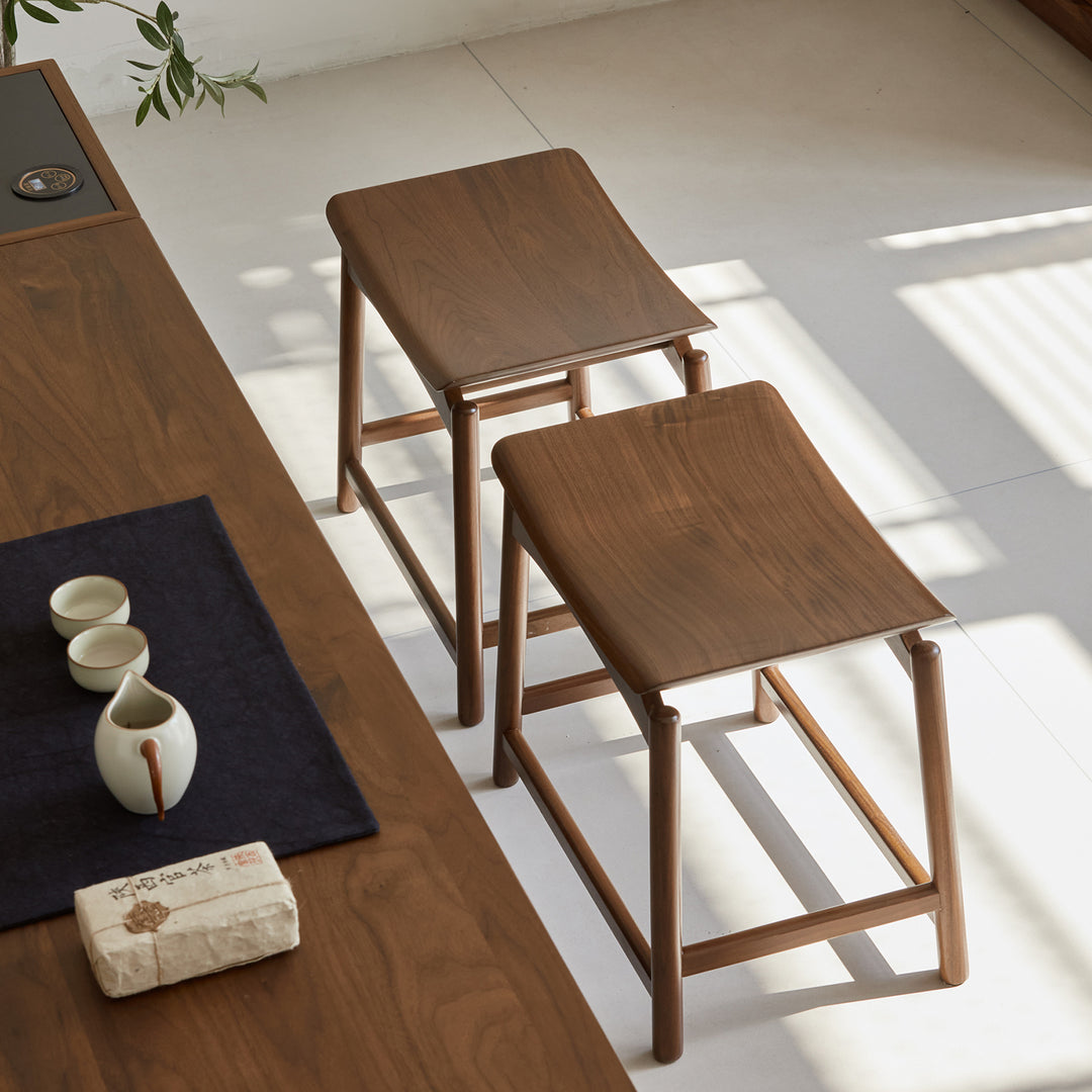 Vintage walnut wood stool arcus in close up details.